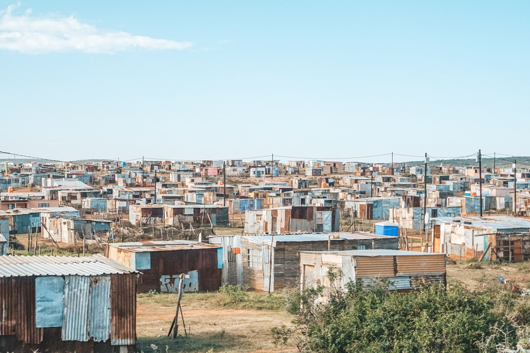 Photo by Filiz Elaerts a bunch of shacks that are in the grass