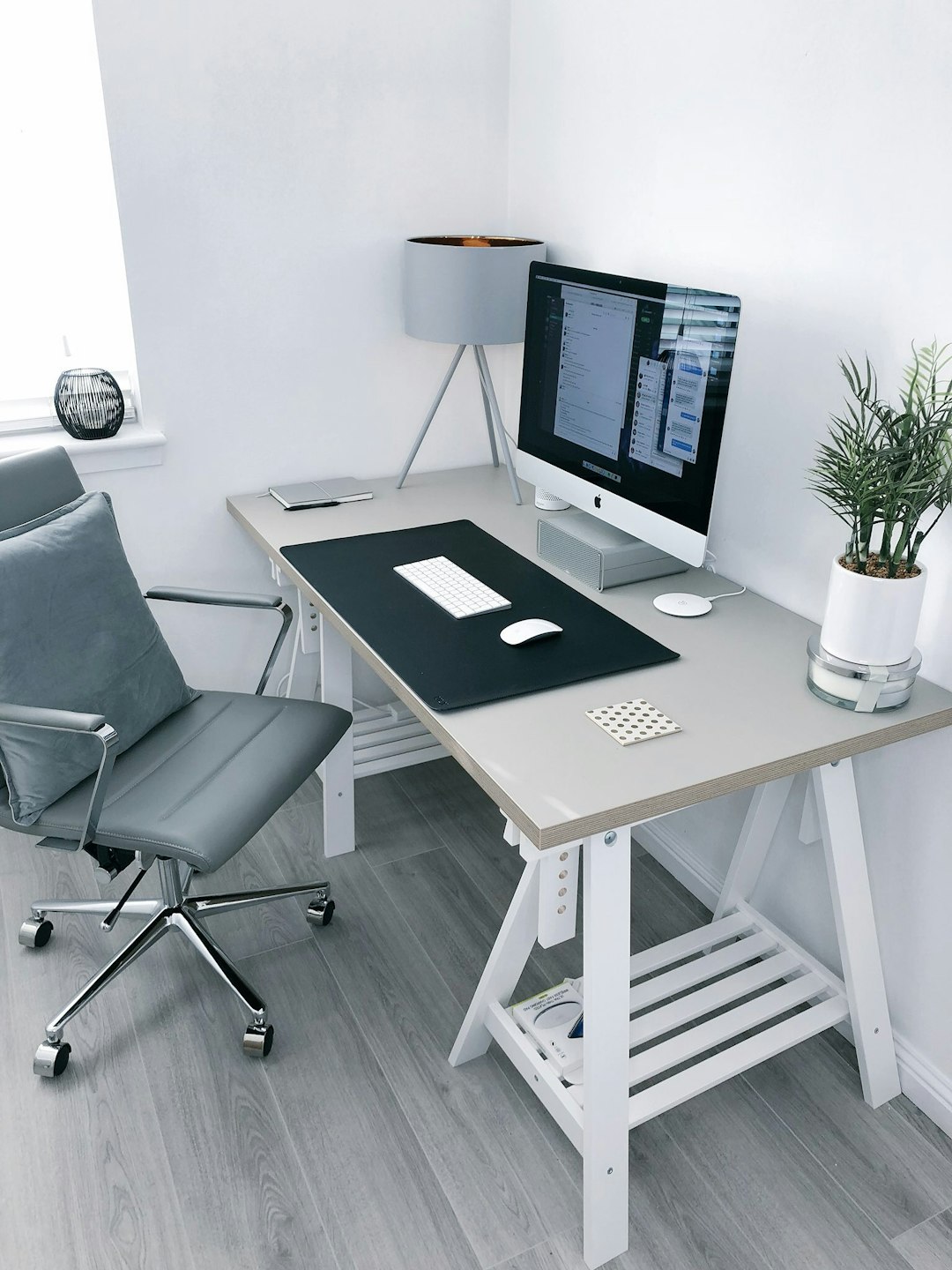 Photo by James McDonald gray leather office rolling armchair beside white wooden computer desk